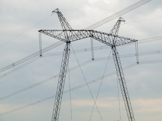  High-voltage power transmission line against the dark sky
