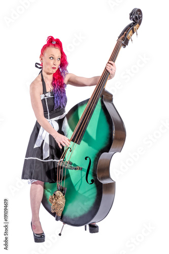 Rock'n'Roll Sängerin mit roten Haaren, Kontrabass und Mikrofon Stock Photo  | Adobe Stock