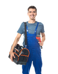 Sticker - Young plumber in uniform with tool bag and pipe wrench on white background