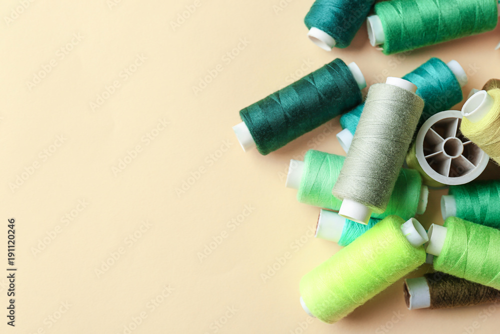 Set of sewing threads on light background