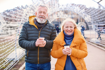 Sticker - Happy mature couple with coffee outdoors