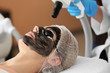 © Africa Studio - Young woman undergoing carbon peeling procedure in salon