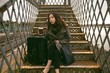 © Wavebreak Media - Thoughtful woman sitting on staircase
