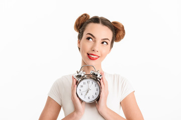 Sticker - Portrait of a pensive casual girl holding alarm clock