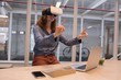 © Wavebreak Media - Female executive using virtual reality headset