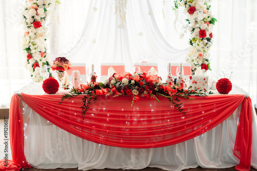 Wedding Banquet Table For Newlyweds Decorated In White And Red