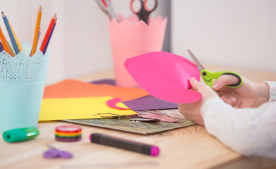  girl play with scissors and color paper
