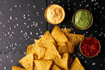 Wall Mural - Triangular corn chips, mexican nachos with sauces