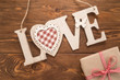 © slava - Love sign on wooden background