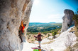 © zhukovvvlad - Training rock climbers in nature.