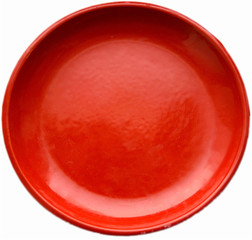 Empty red porcelain plate isolated on white background close-up. Kitchen utensils,top view