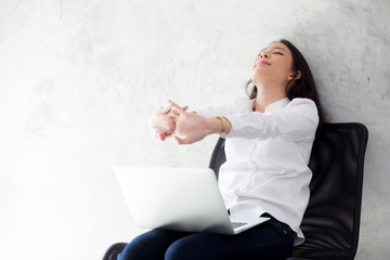 Wall Mural - Beautiful young asian woman with laptop stretch and exercise relax after work success, modern office with copy space, freelance business concept.