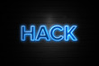 Hack neon Sign on brickwall