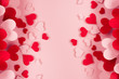 Valentine day background of many different paper hearts on pink soft background. Copy space.
