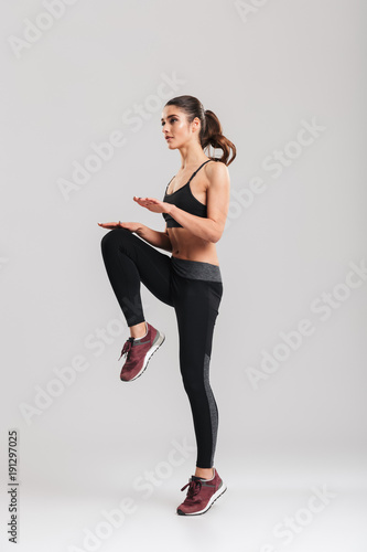 Принти на полотні Full-length image of strong-willed female fitness trainer of instructor in sport