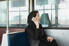 Woman In Hijab Talking On Mobile Phone