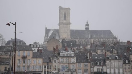 Wall Mural - Winter cityscape, snowfall in the old European city