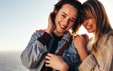 Cheerful female friends on holidays outdoors