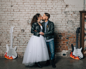 Wedding in the style of rock. Rocker or Biker wedding. Guys with stylish leather jackets. It's a rock'n'roll baby!