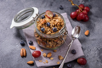 Wall Mural - Granola with berries, nuts and seeds, energy snack or healthy breakfast concept