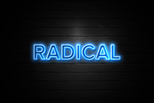 Radical Neon Sign On Brickwall