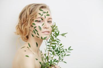 Wall Mural - green leaves on face