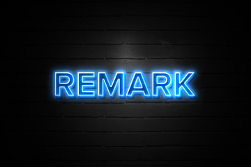 remark neon sign on brickwall