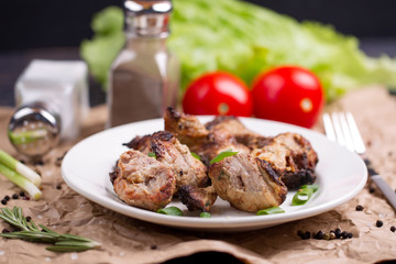 Shish kebab with onions and rosemary and tomatoes