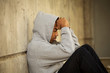 © digitalskillet1 - African American young teen feeling depressed.