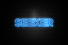 Seeker Neon Sign On Brickwall