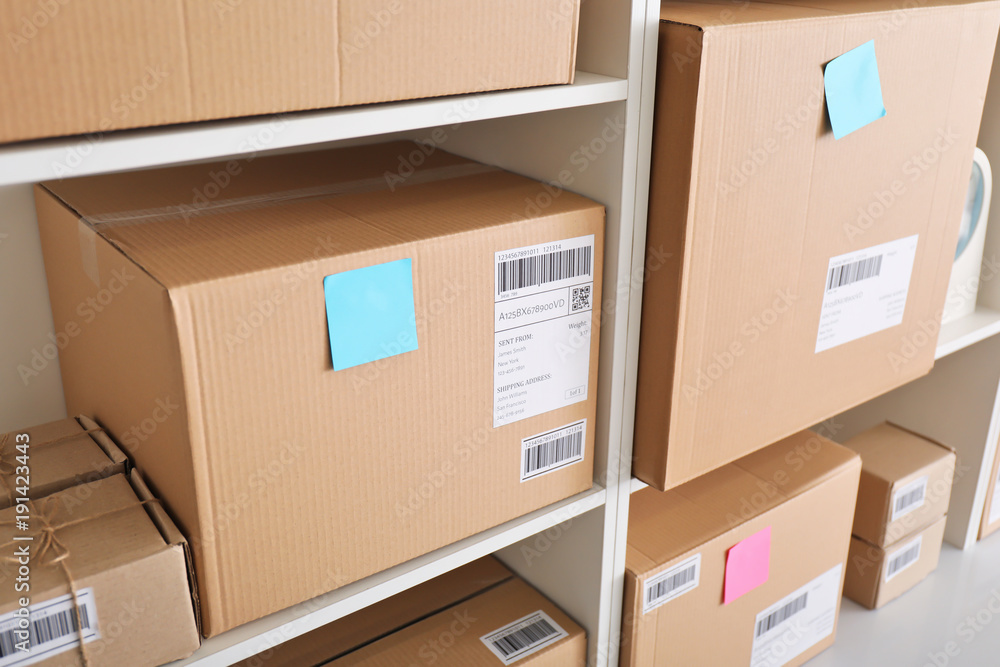 Shelving with parcels ready for shipment to customers in home office. Startup business