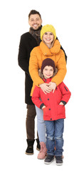 Canvas Print - Happy family in warm clothing on white background. Ready for winter vacation