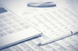 Financial accounting pen and calculator on balance sheets