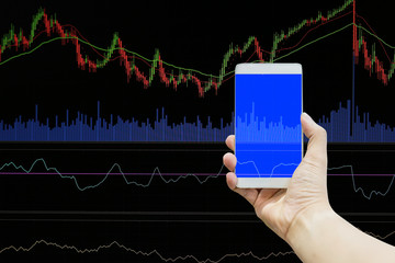 Wall Mural - hand smartphone with financial stock chart business concept