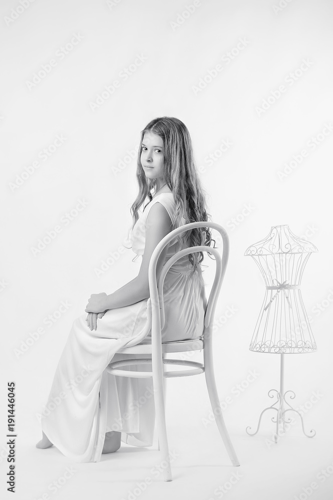 nude young girl 2017 Young girl with sheer skin and Nude makeup sits on a white vintage chair on  a grey isolate black and white image の Stock フォト | Adobe Stock