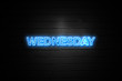 Wednesday neon Sign on brickwall