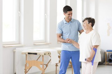 Disabled senior woman during rehabilitation