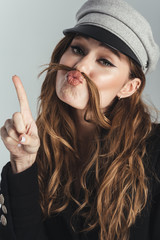 Poster - Fashion portrait of a funny stylish curly brown haired woman