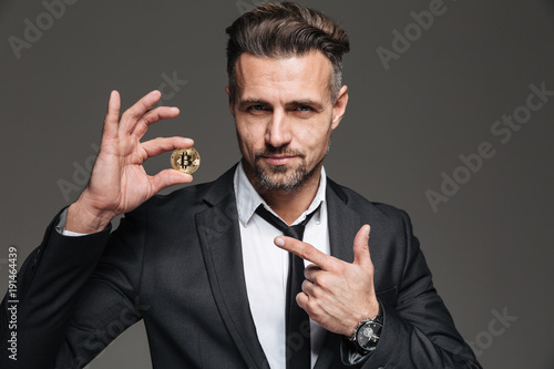 Photo Of Successful Mature Man With Brown Hair In Suit And Tie