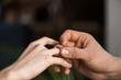 © LIGHTFIELD STUDIOS - cropped image of boyfriend proposing girlfriend and wearing engagement ring