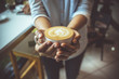 Woman hand holding coffe cup in coffee shop