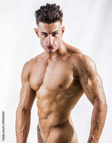 Good Looking Young Gym Fit Man Showing His Y Six Pack Abs While Good Looking Young Gym Fit Man Showing His Y Six Pack Abs While Up