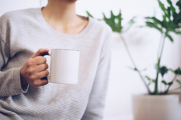 Hand holding coffee cup