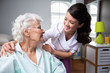 © didesign - Smiling nurse and old woman patient at wheelchair