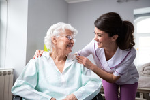 Satisfied And Happy Senior Woman Patient With Nurse