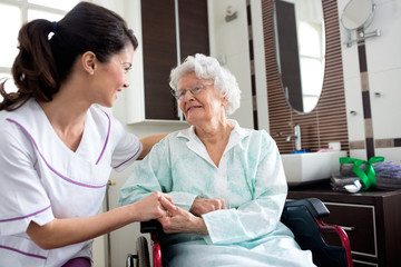 Senior old woman with nurse