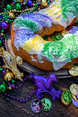 Wall Mural - king cake surrounded by mardi gras decorations