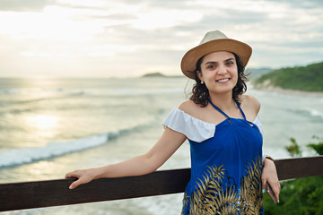 Wall Mural - One hispanic woman on sunset background