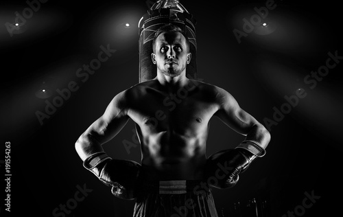 Leinwand Poster Professional sportsman of mixed martial arts stands after the fight won near the