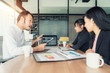 © Prasit Rodphan - Asian businessman present sell graph at meeting room in office. Business present and meeting concept.